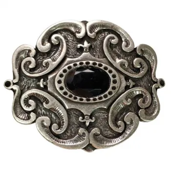 Belt buckle tendrils with black stone